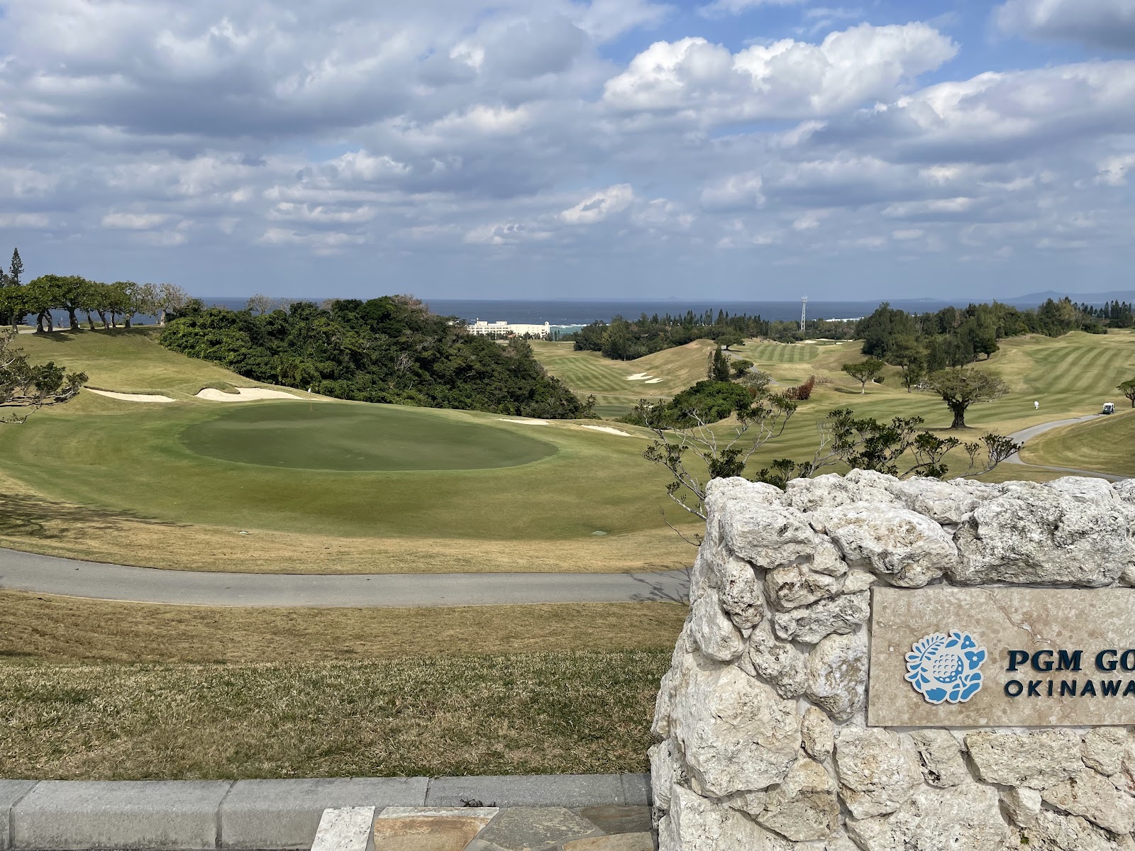 Golf course in Okinawa, Japan, fairway above the subtropical coastline of the East China Sea