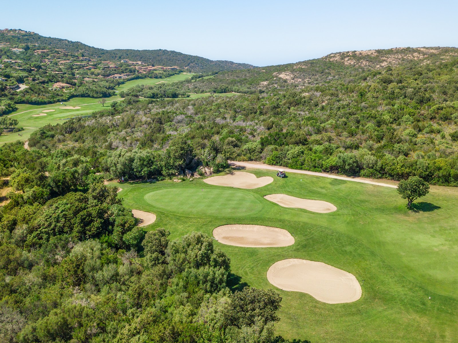 Pevero Golf Club on the Costa Smeralda, granite and maquis framing the fairways above the bay in Sardinia