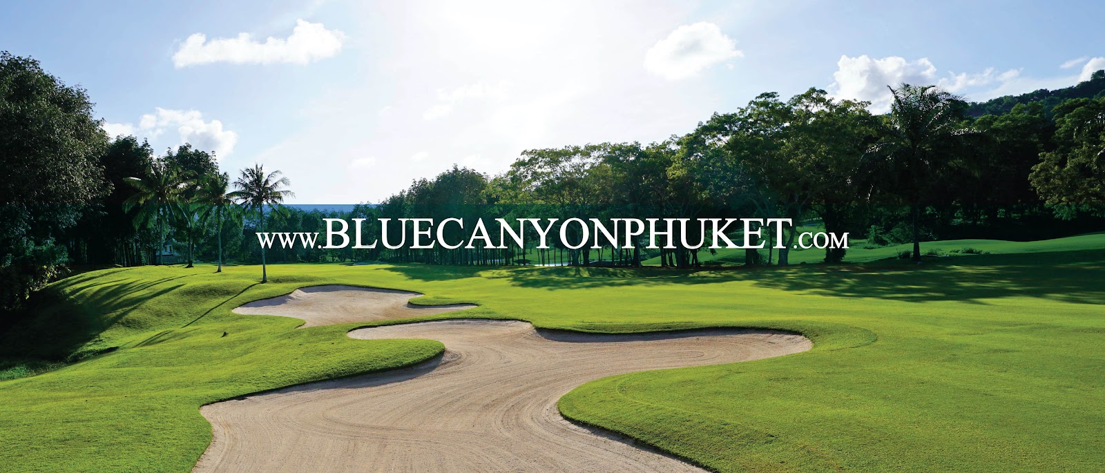 Blue Canyon Country Club golf course among palms and water, Phuket, Thailand