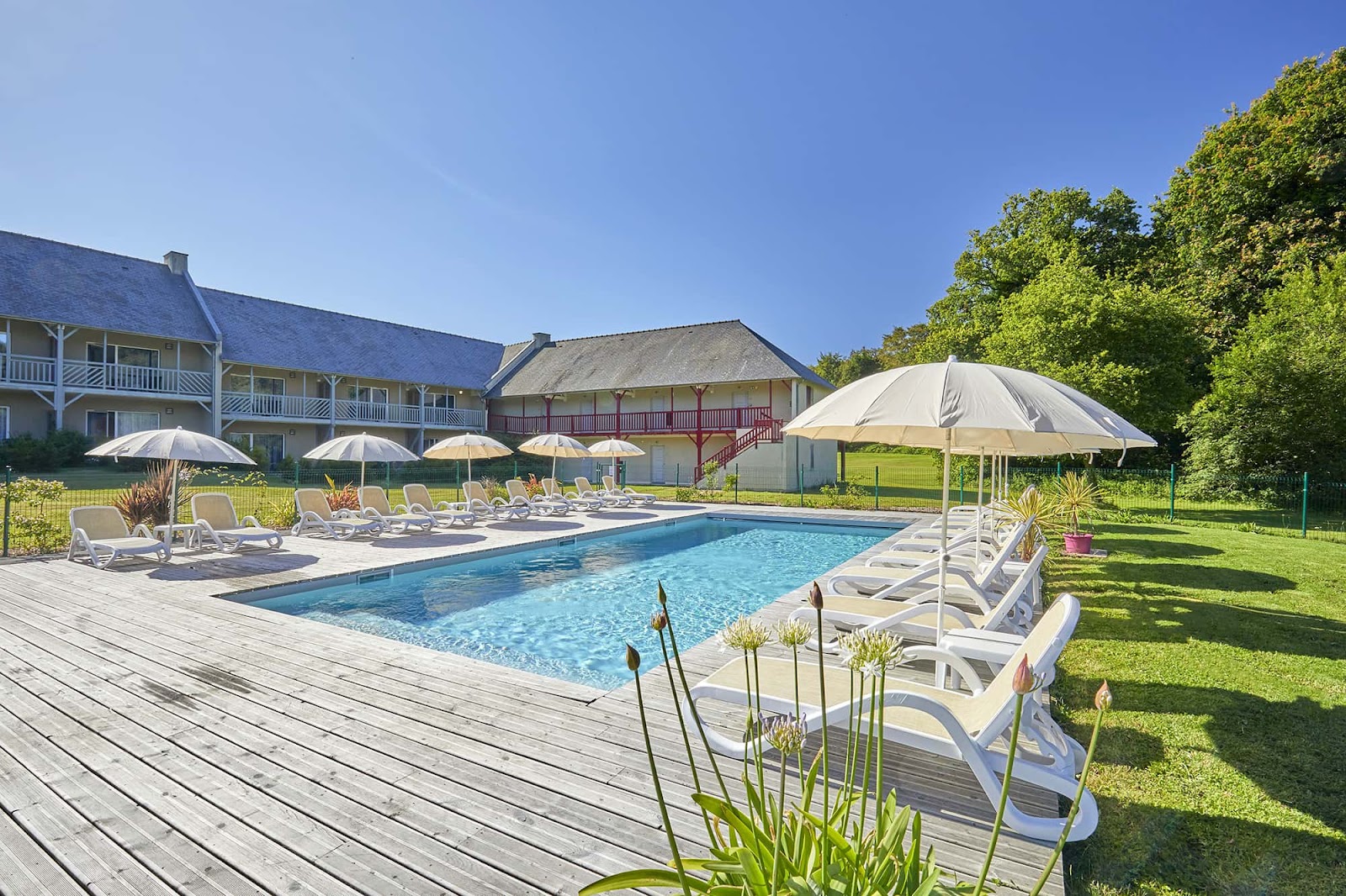 Saint-Malo Golf Resort at Le Tronchet, Brittany, fairway running between lakes and Breton forest