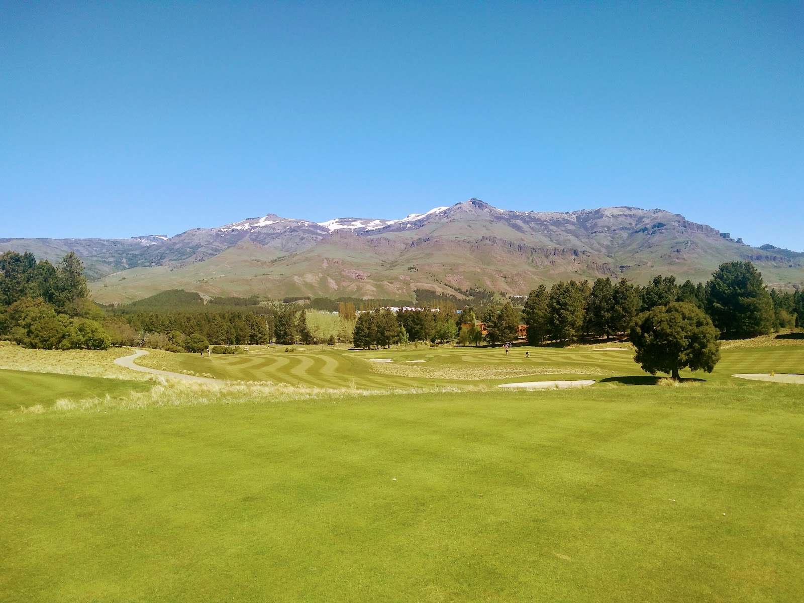 Chapelco Golf and Resort, parkland fairway framed by Andean peaks near San Martin de los Andes, Argentina