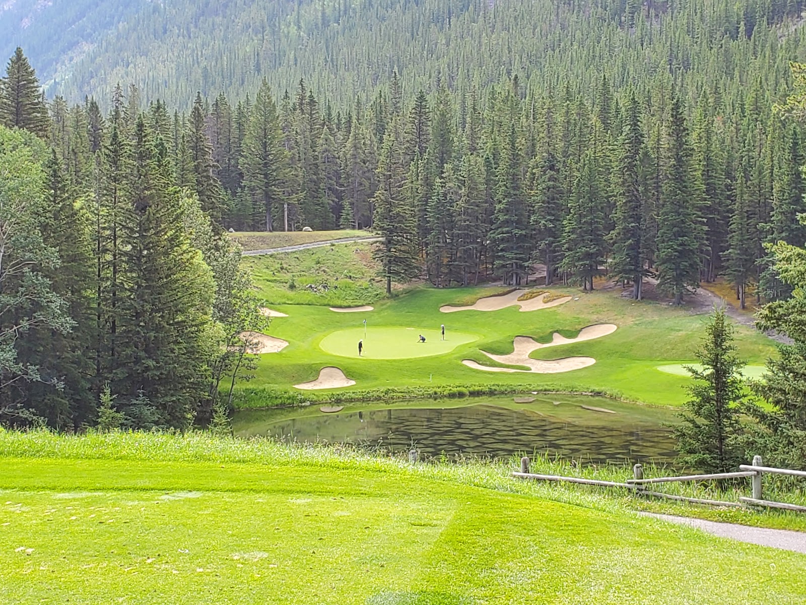 Fairmont Banff Springs golf course, fairway beneath the snow capped peaks of Mount Rundle and Sulphur Mountain, Alberta