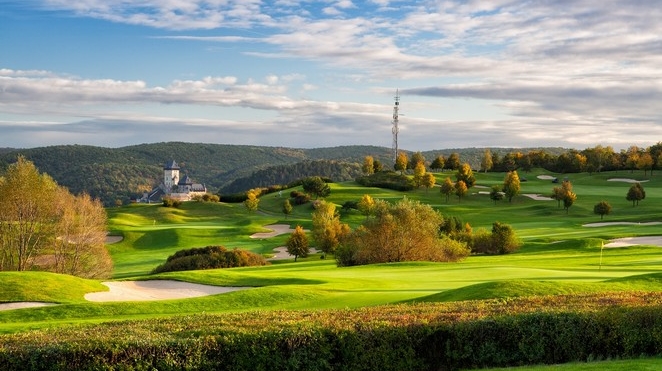 Golf Resort Karlstejn, Czechia, fairway below the towers of Karlstejn Castle