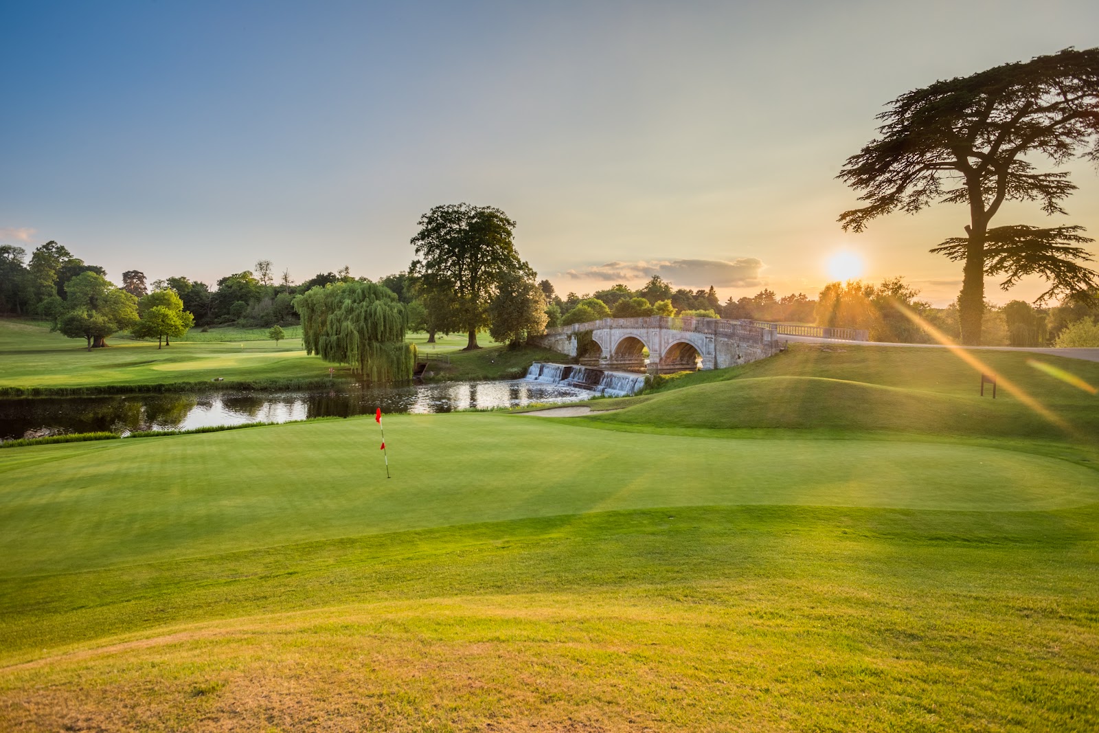 Brocket Hall Melbourne Course, parkland fairway beside the Broadwater lake below the Palladian mansion near Welwyn, Hertfordshire, England