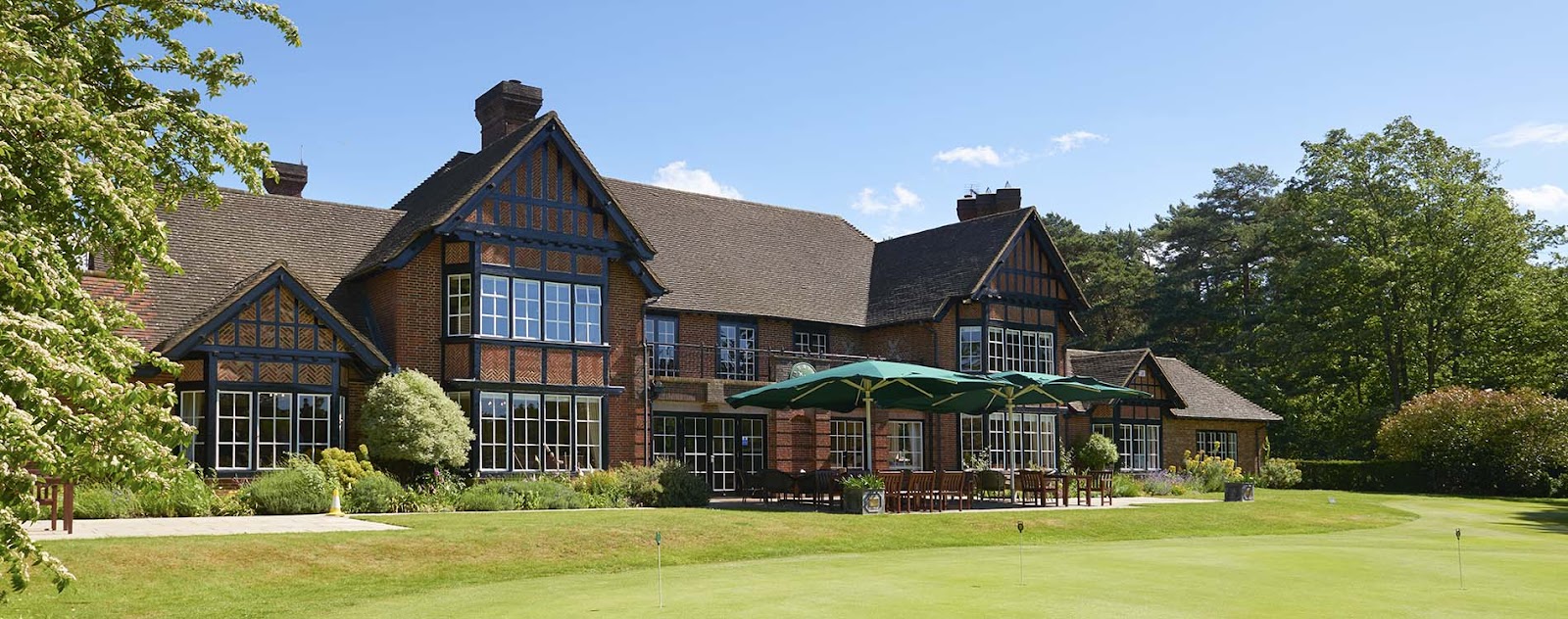Swinley Forest Golf Club, a heathland fairway framed by Scots pine and heather near Ascot, England