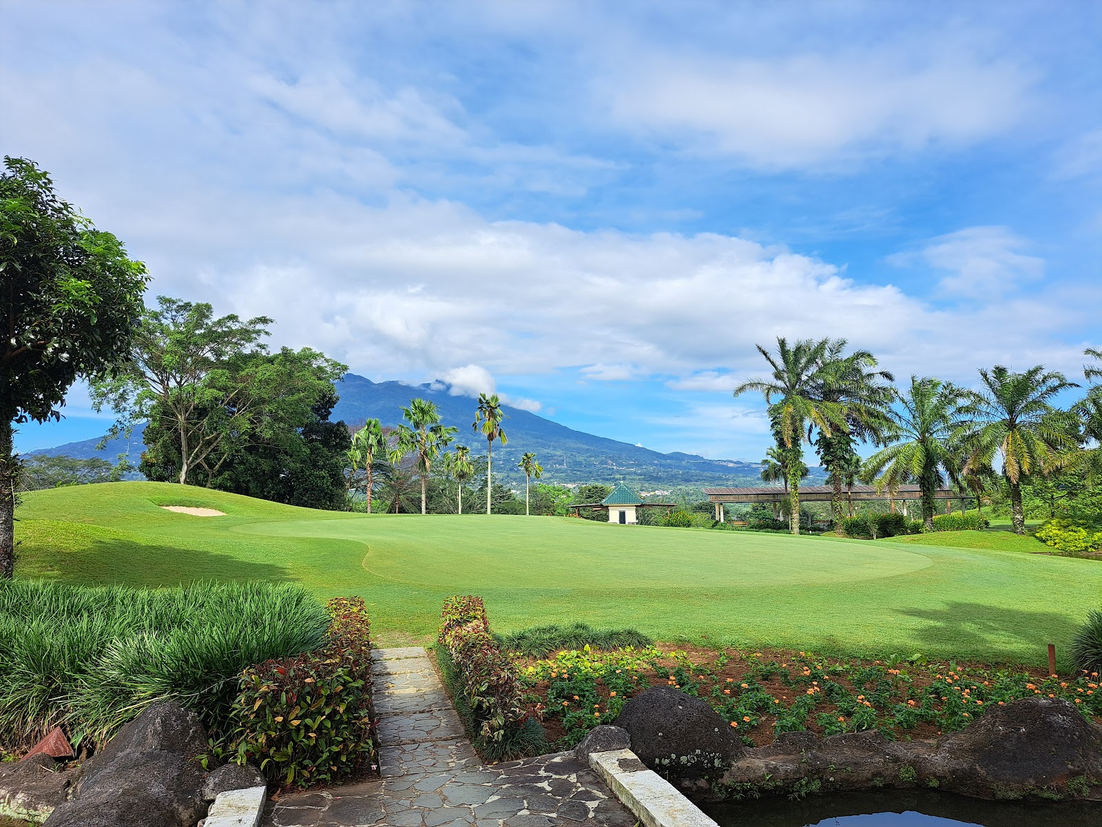 Rancamaya Golf and Country Club, parkland fairway below Mount Salak near Bogor, West Java, Indonesia