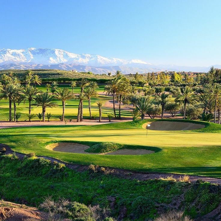 Assoufid Golf Club, desert fairways below the snow capped Atlas Mountains near Marrakech, Morocco