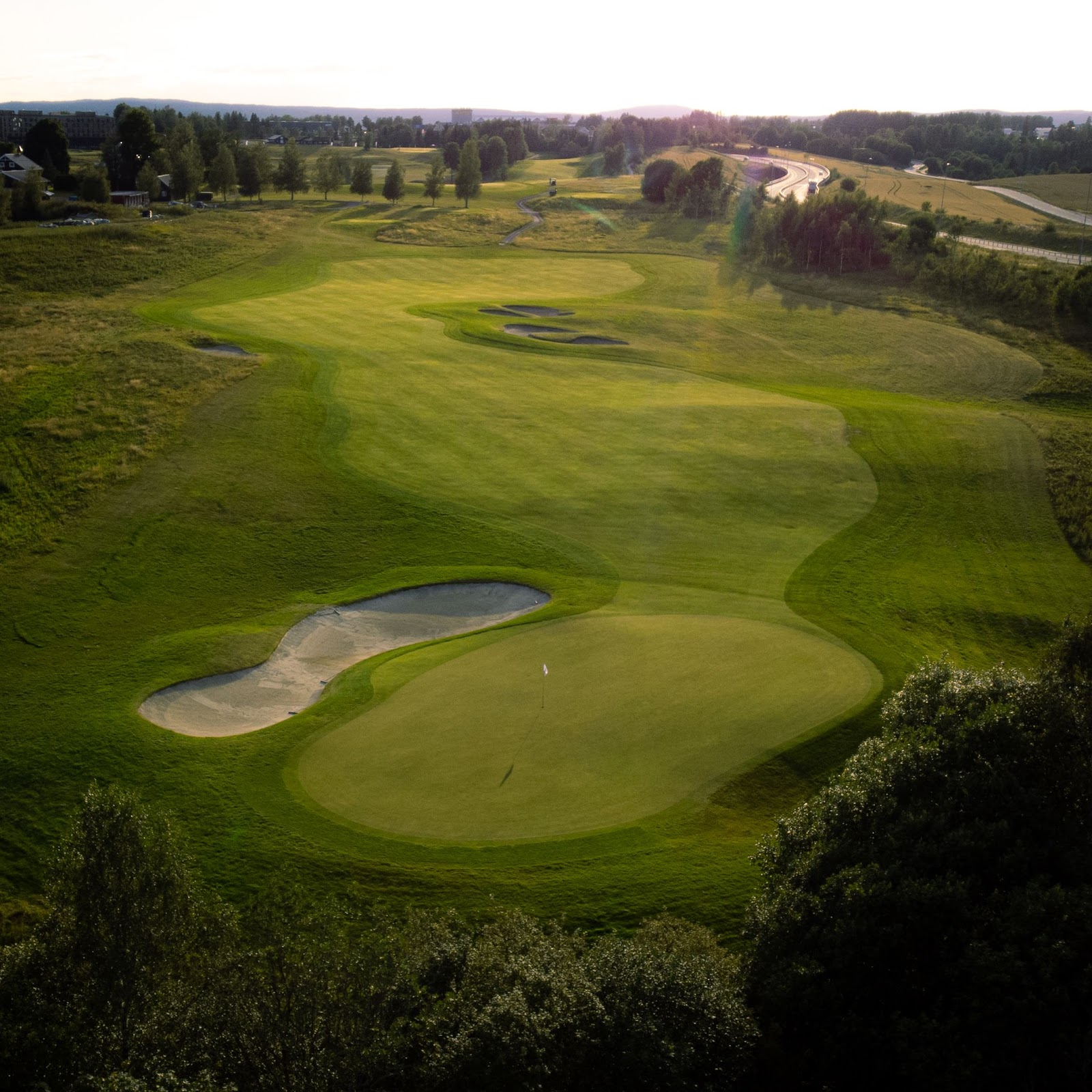 Miklagard Golf, parkland fairway framed by forest near Klofta and Oslo, Norway