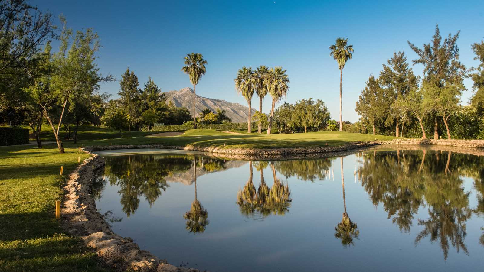 La Quinta Golf and Country Club, fairways rolling through the hills of Benahavis above Marbella with the Mediterranean beyond