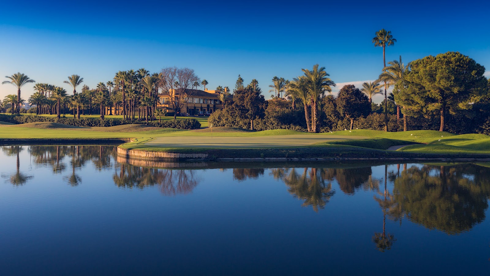 Real Club de Golf de Sevilla near Seville, broad championship fairways and water hazards on Jose Maria Olazabal's design in Andalusia