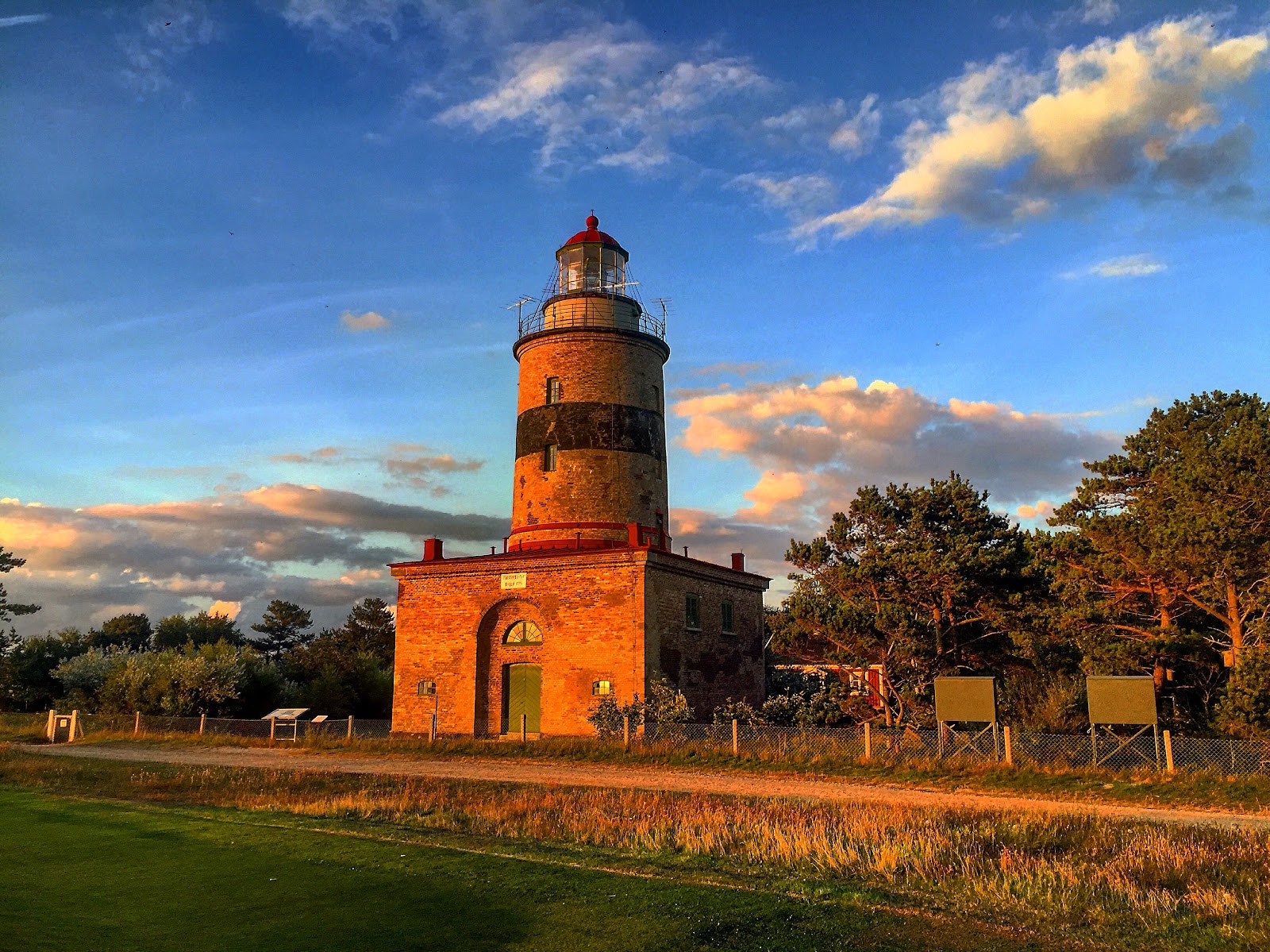 Falsterbo Golfklubb, firm links fairways and sea grasses running out toward the lighthouse at the southwest tip of Skane, Sweden