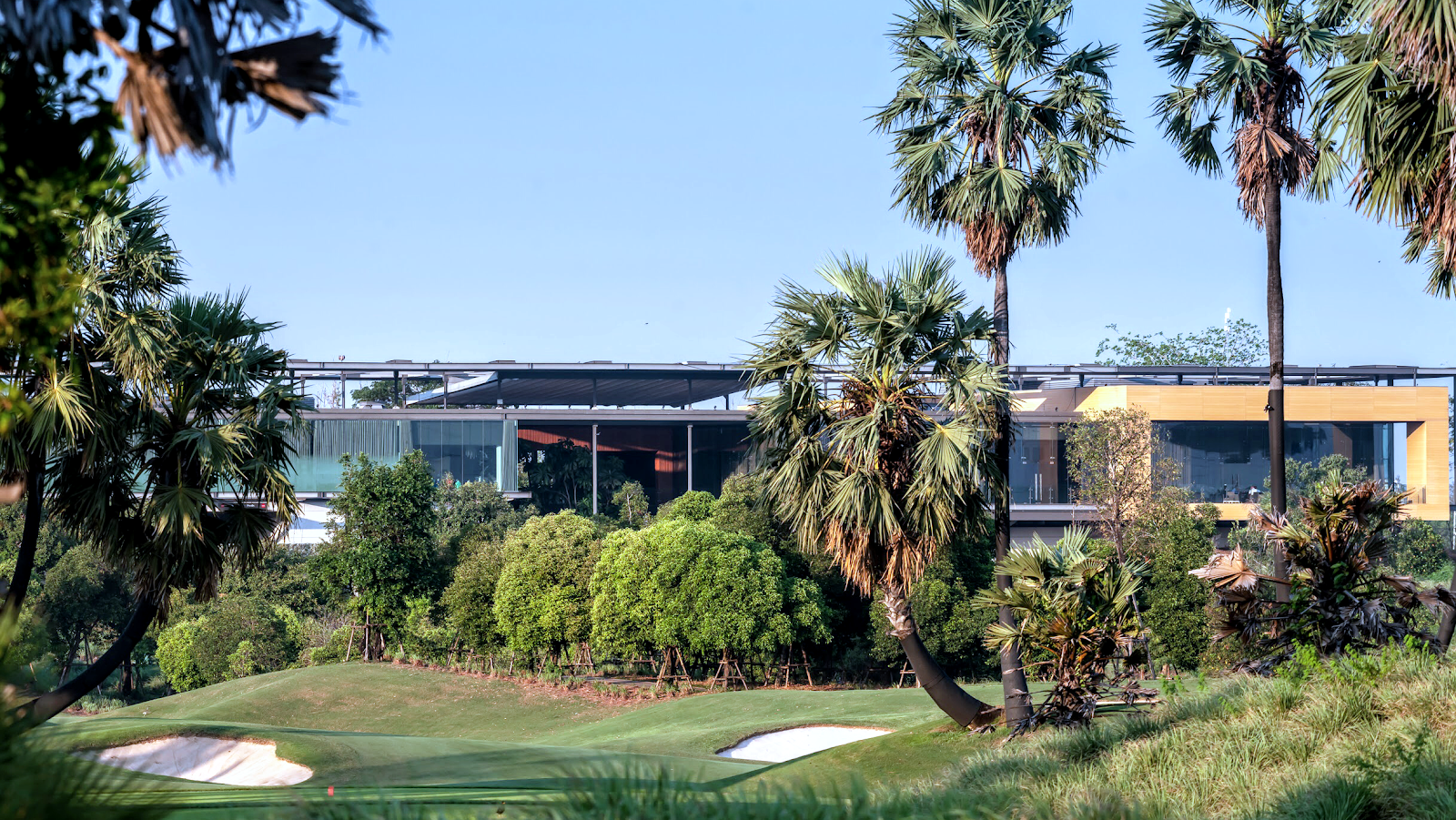 Nikanti Golf Club fairways and lakes on former rice paddies in Nakhon Pathom near Bangkok, Thailand