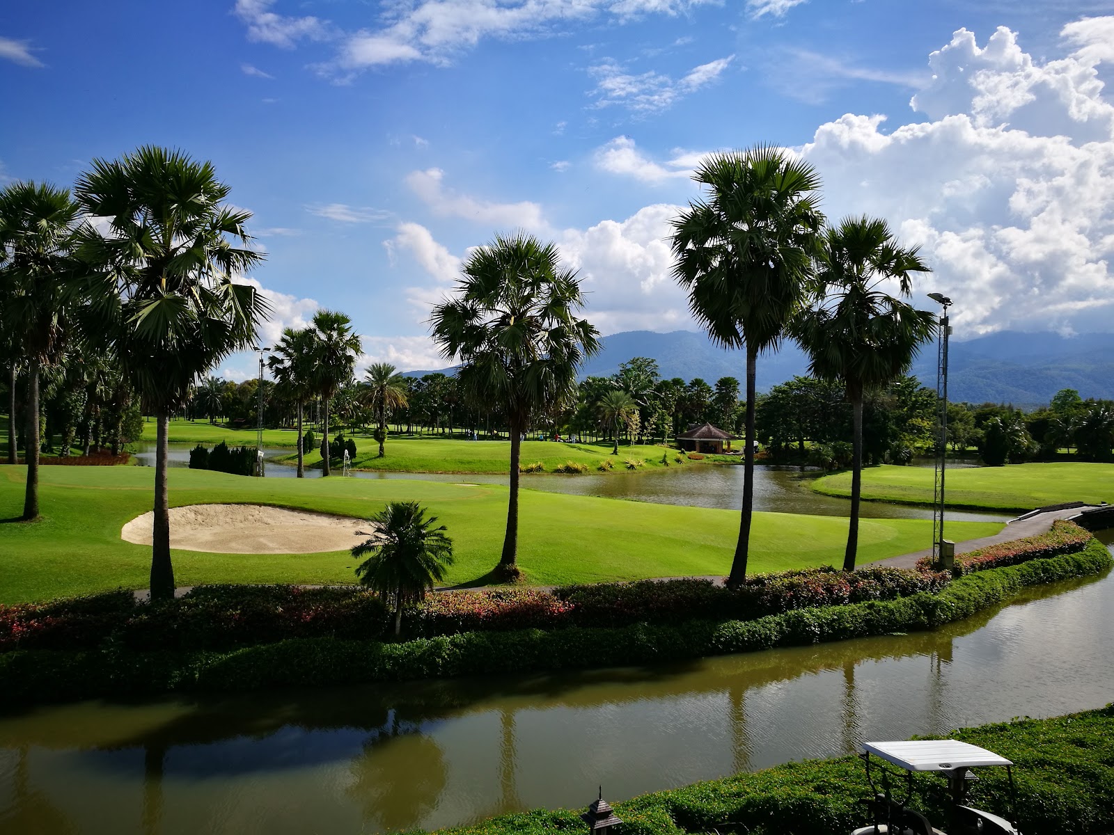 Summit Green Valley Chiangmai Country Club, palm lined fairways and lakes in the Mae Sa valley near Chiang Mai, Thailand
