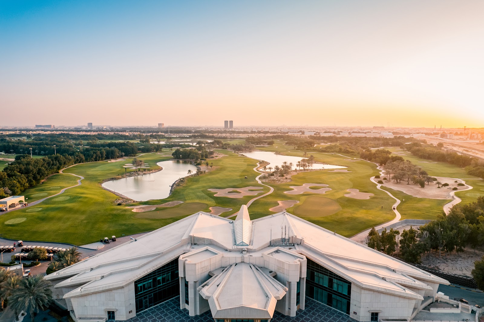Abu Dhabi Golf Club National Course, manicured fairways beneath the falcon shaped clubhouse