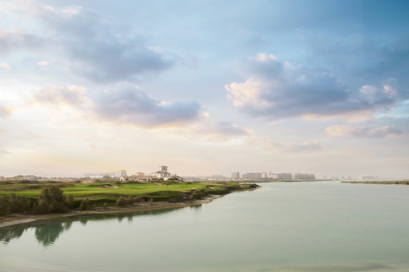 Yas Links Abu Dhabi, links fairways wrapping a saltwater lagoon on Yas Island, United Arab Emirates