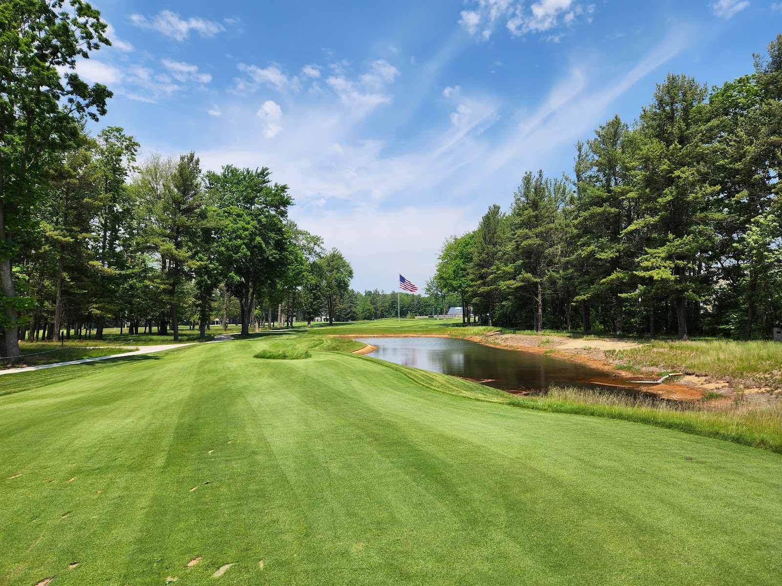 American Dunes Golf Club, a fairway framed by sand and pine near Grand Haven, Michigan