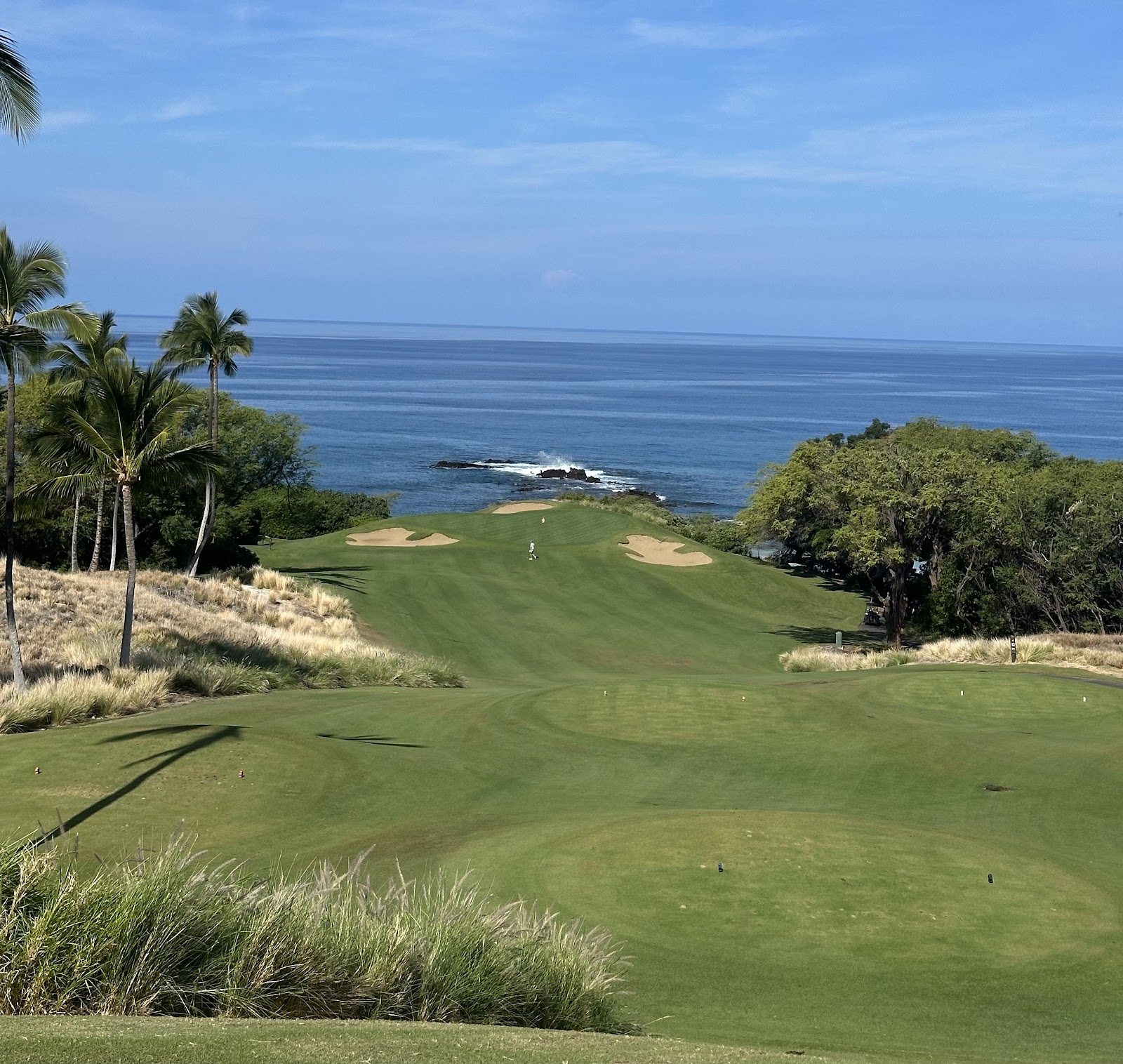 Mauna Kea Golf Course on the Kohala Coast of Hawaii's Big Island, green fairways against black lava and the blue Pacific