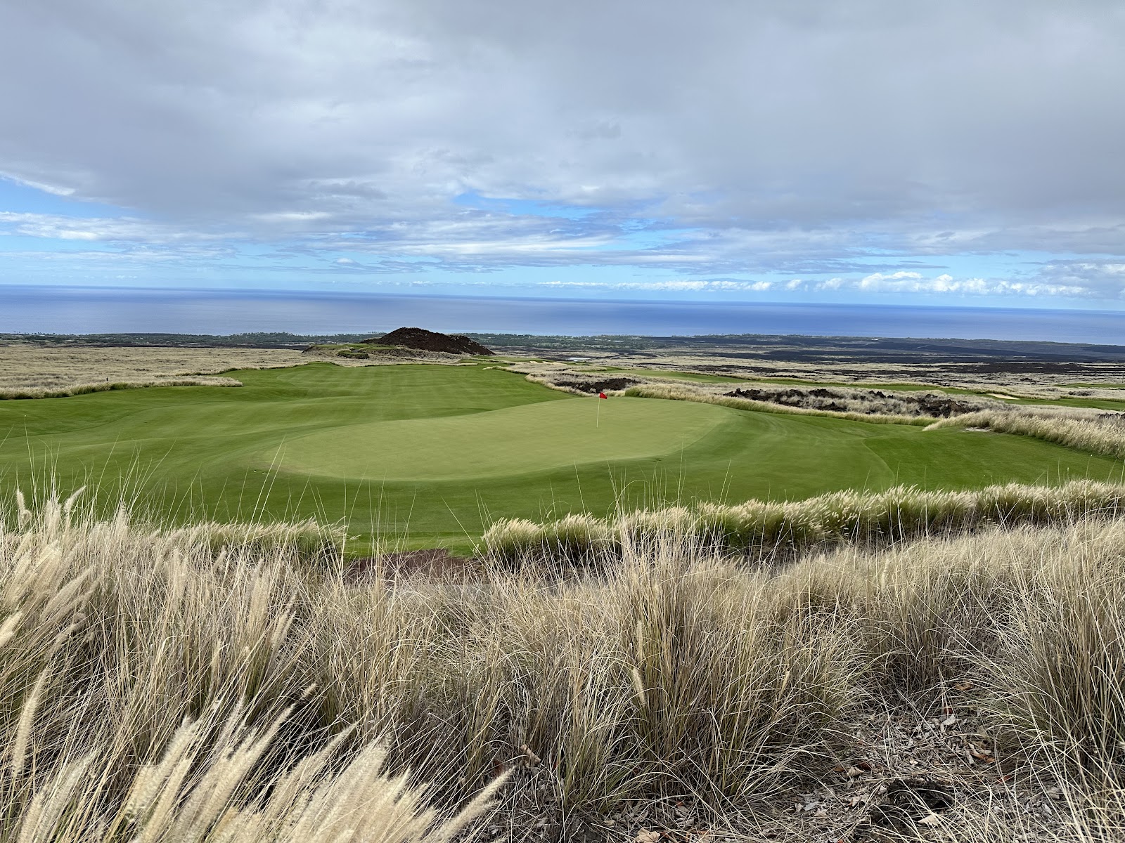 Nanea Golf Club, wide fairways through black lava high above the Kona coast of Hawaii Island