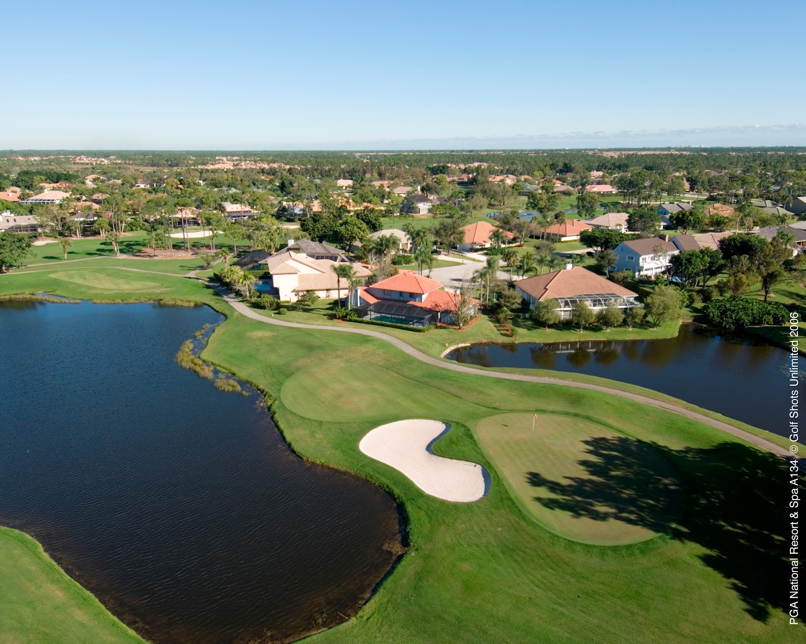 PGA National Champion Course, water guarding a green in the Bear Trap stretch, Palm Beach Gardens, Florida