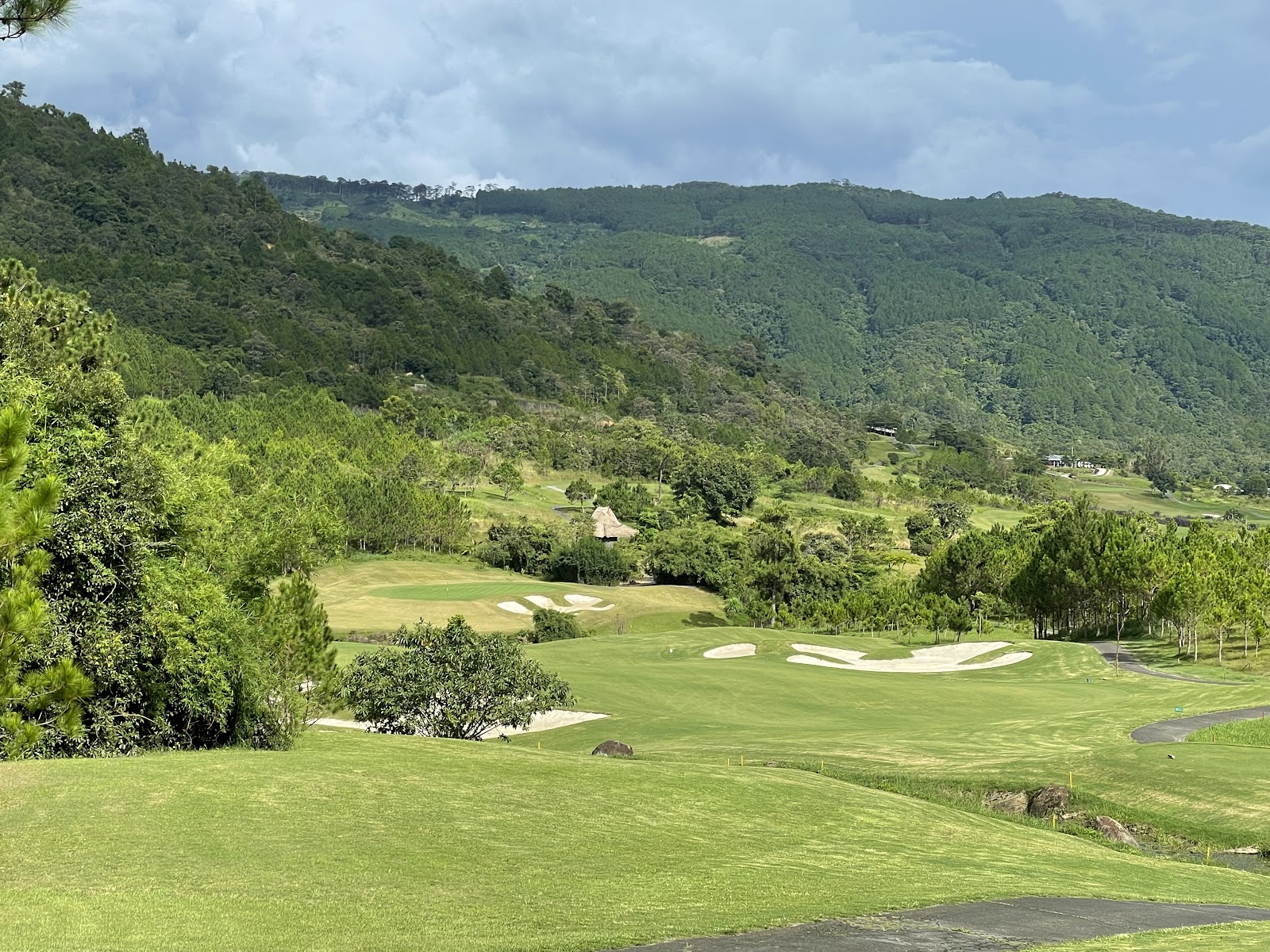 The Dalat at 1200 Country Club, alpine fairway through pine forest above a spring fed lake, Vietnam