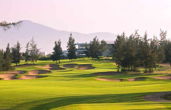Montgomerie Links Vietnam, a rippled links fairway among casuarina pines between Da Nang and Hoi An