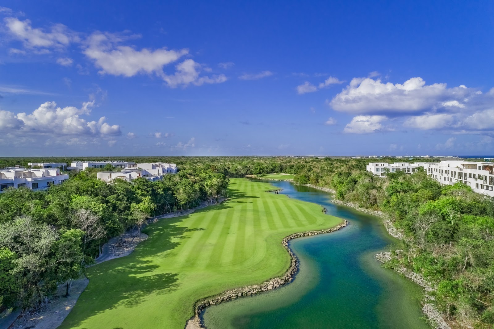 Tropical golf course threading through jungle and mangrove on Mexico's Riviera Maya
