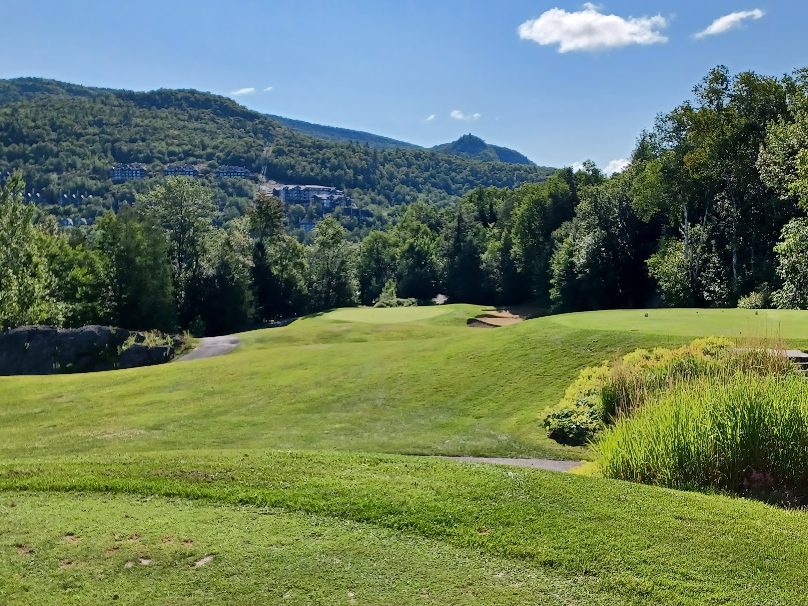 Golf Le Geant at Mont Tremblant, fairway carved into the Laurentian mountainside in Quebec