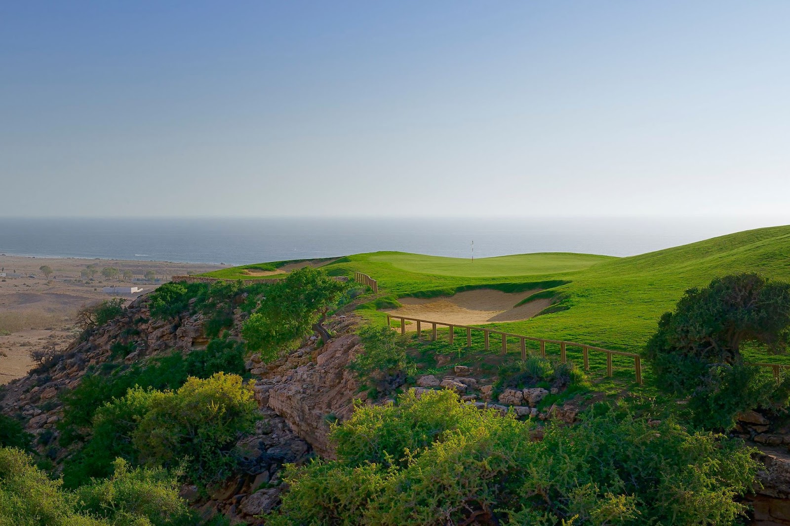 A green Agadir golf course with palms and Atlantic backdrop, the value winter sun coast of Morocco