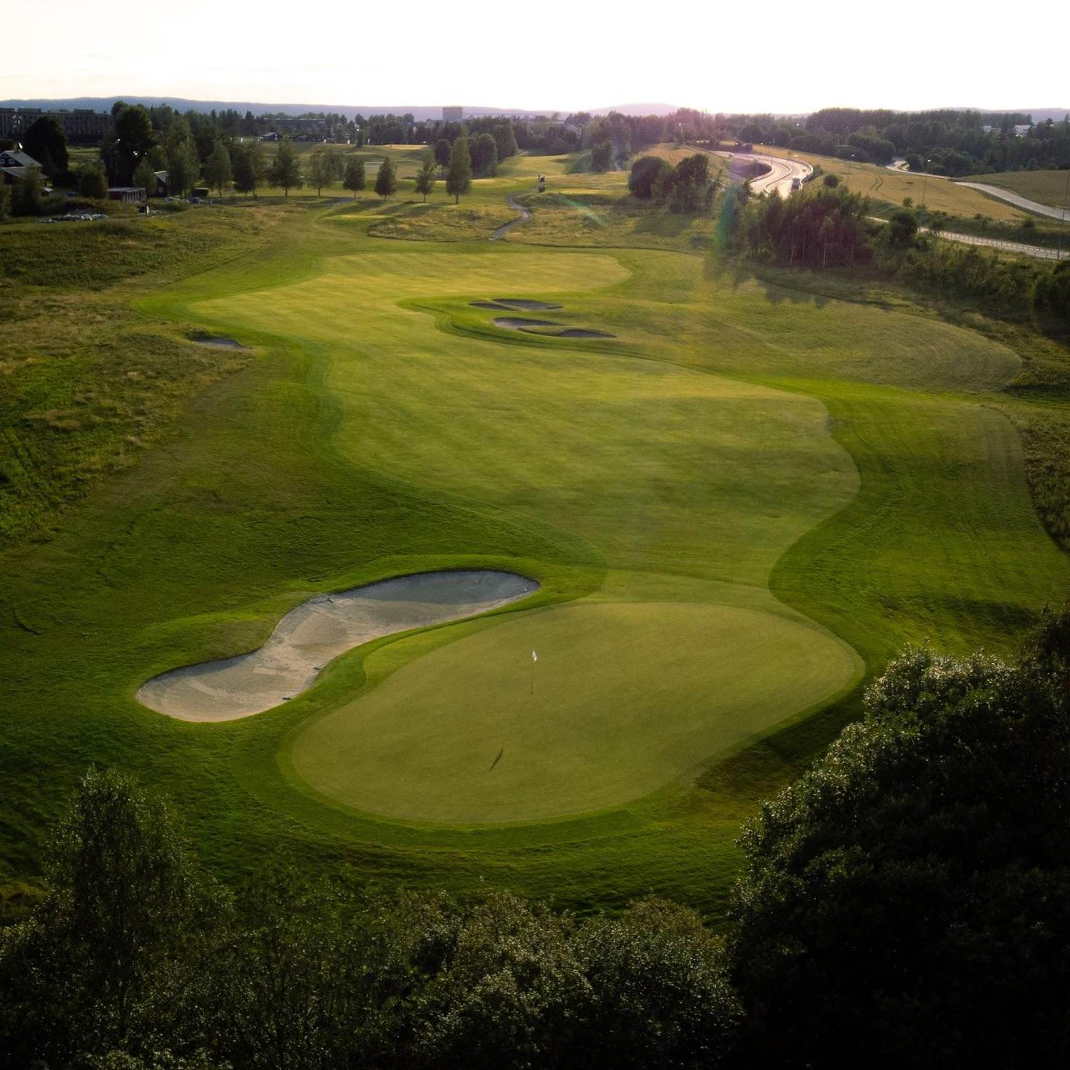 Miklagard Golf Club fairway through forest near Oslo, Norway